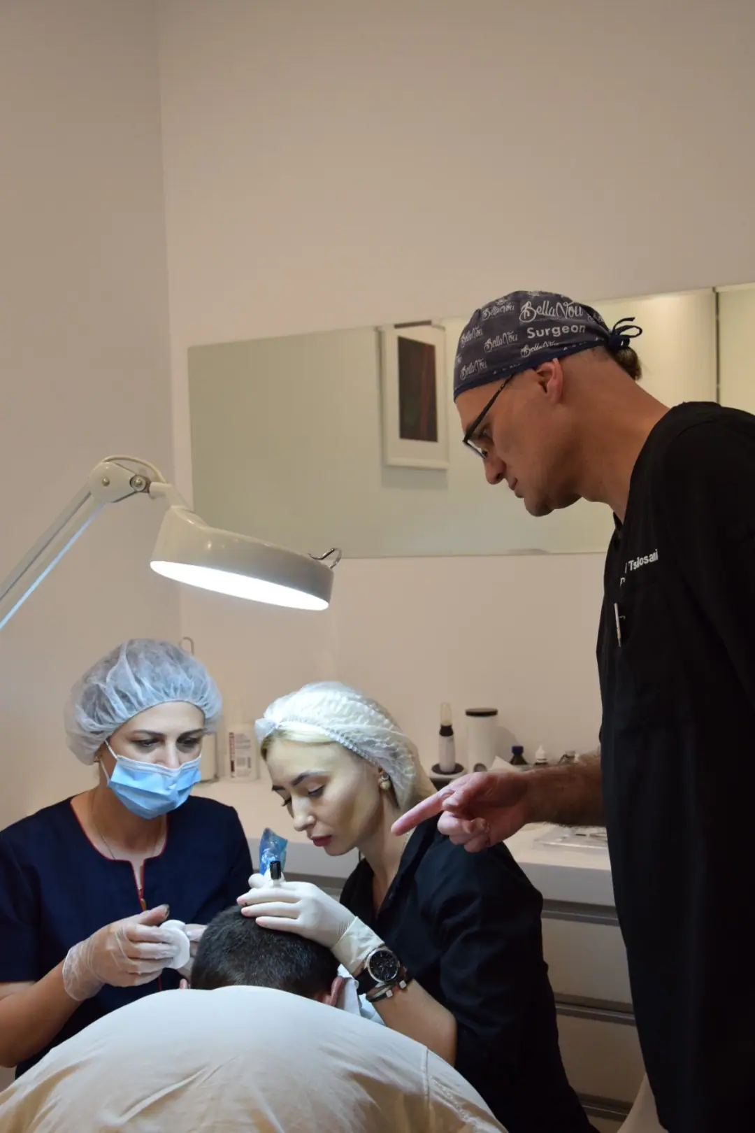 Dr. Tsilosani instructing trainee doctors during a procedure