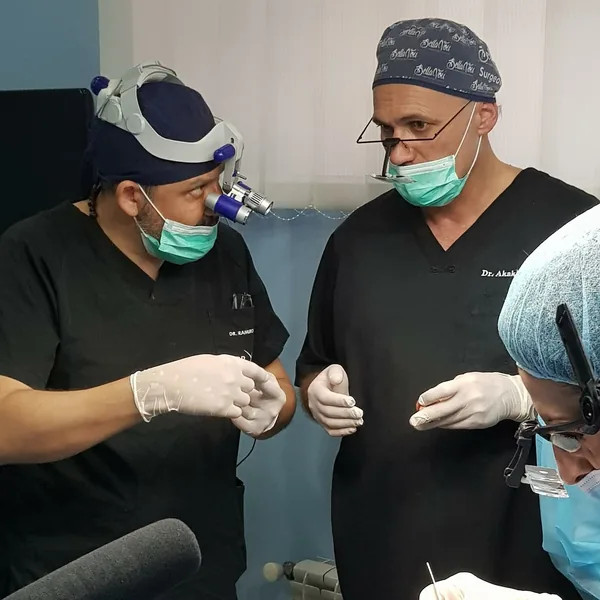 Dr. Tsilosani guiding a doctor during a graft-harvesting procedure
